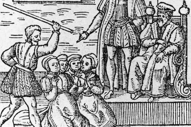 A group of supposed witches being beaten in front of King James I (King James VI of Scotland) around 1610