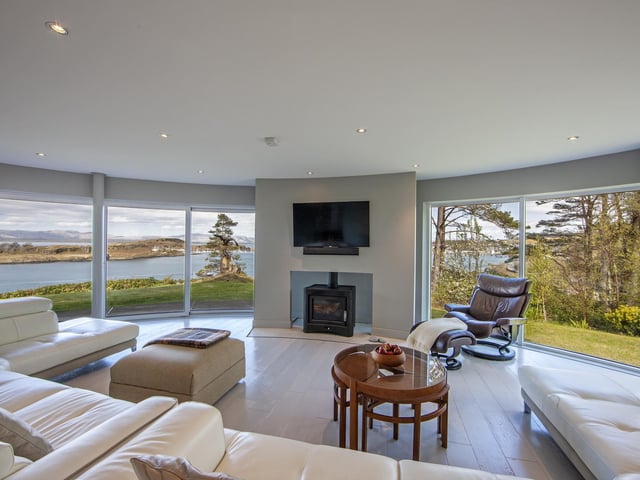 There are magnificent views from the living space, which features a log-burning stove