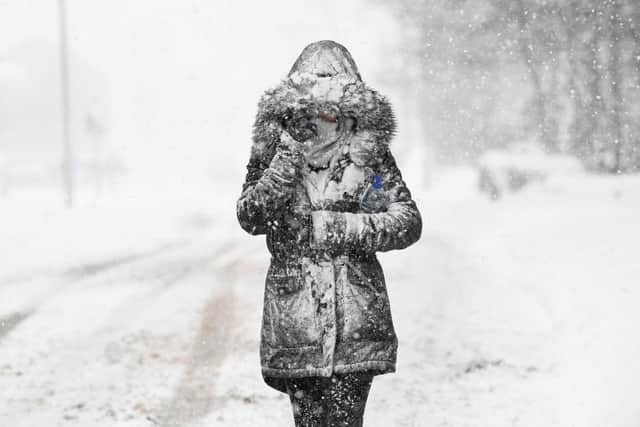 A woman makes her way through the snow in Balloch, in freezing weather conditions dubbed the 'Beast from the East' in 2018 (Photo: Jeff J Mitchell/Getty Images)