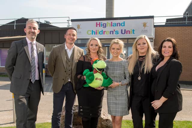 The Highland Fundraising Board outside the Highland Children's Unit, along with Dawn Cowie, third from the right. The board have assisted in projects such as the Archie Fresh Air Project, transforming the outdoor space at the unit from a "concrete jungle" into a fun green space suitable for children.
