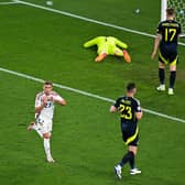 Kevin Csoboth scores for Hungary to leave Scotland players devastated. (Photo by DAMIEN MEYER/AFP via Getty Images)