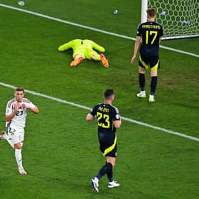 Kevin Csoboth scores for Hungary to leave Scotland players devastated. (Photo by DAMIEN MEYER/AFP via Getty Images)