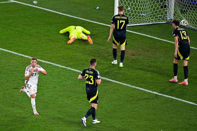 Kevin Csoboth scores for Hungary to leave Scotland players devastated. (Photo by DAMIEN MEYER/AFP via Getty Images)