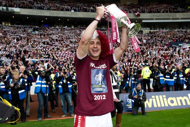 Rudi Skacel celebrates with the Scottish Cup after Hearts' 5-1 win over rivals Hibs in 2012