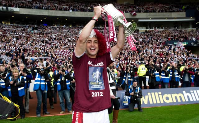 Rudi Skacel celebrates with the Scottish Cup after Hearts' 5-1 win over rivals Hibs in 2012