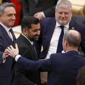 Newly elected First Minister Humza Yousaf is congratulated by MSPs in the Scottish Parliament (Picture: Jeff J Mitchell/Getty Images)