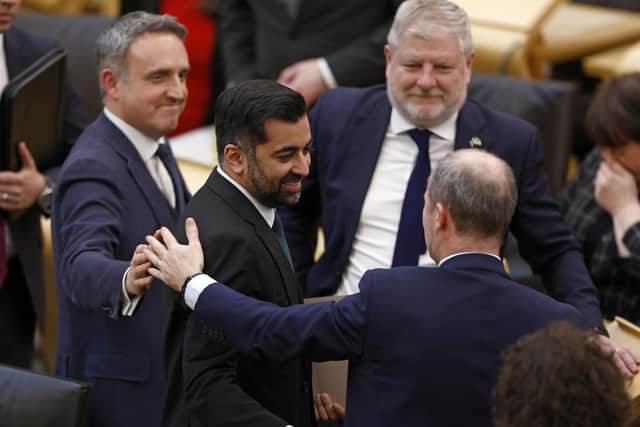 Newly elected First Minister Humza Yousaf is congratulated by MSPs in the Scottish Parliament (Picture: Jeff J Mitchell/Getty Images)