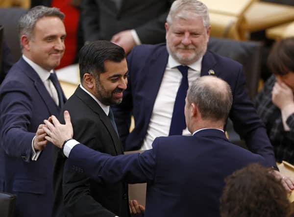 Newly elected First Minister Humza Yousaf is congratulated by MSPs in the Scottish Parliament (Picture: Jeff J Mitchell/Getty Images)