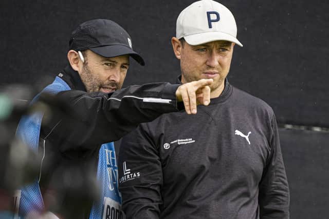 Graeme Robertson chats with caddie Mark Cox at the Hoylake venue. Picture: Tom Russo/The Scotsman.