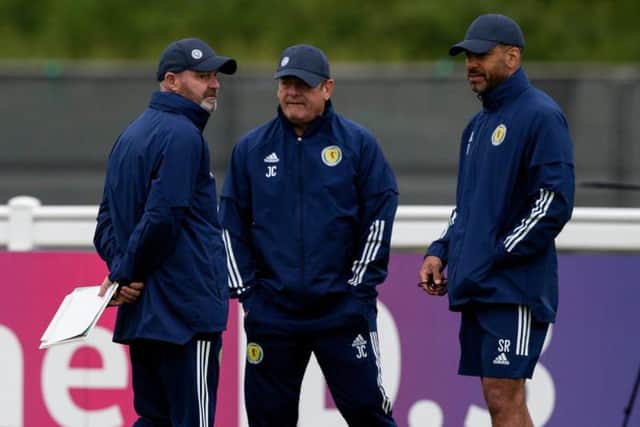 Scotland manager Steve Clarke (left) in discussion with his assistants John Carver (centre) and Steven Reid (right) during a training session on Monday. (Photo by Craig Williamson / SNS Group)