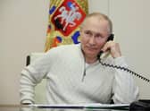 Russian president Vladimir Putin speaks on the phone. Picture: Mikhail Klimentyev, Sputnik, Kremlin Pool Photo via AP