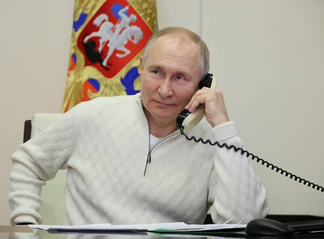 Russian president Vladimir Putin speaks on the phone. Picture: Mikhail Klimentyev, Sputnik, Kremlin Pool Photo via AP