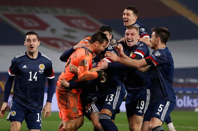 Scotland goalkeeper David Marshall celebrates with teammates following last week's play-off final victory over Serbia  (Photo by Srdjan Stevanovic/Getty Images)