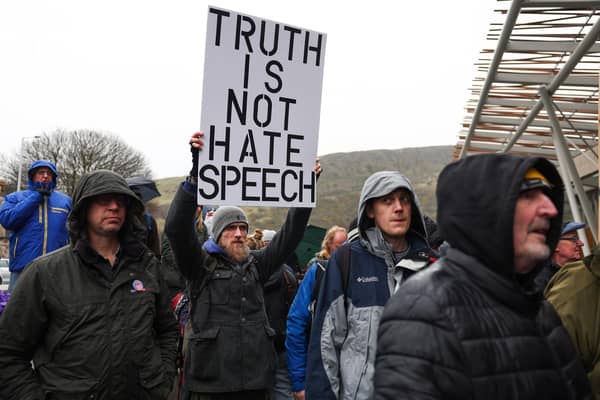 Protesters demonstrate against the Hate Crime Act outside the Scottish Parliament (Picture: Jeff J Mitchell/Getty Images)