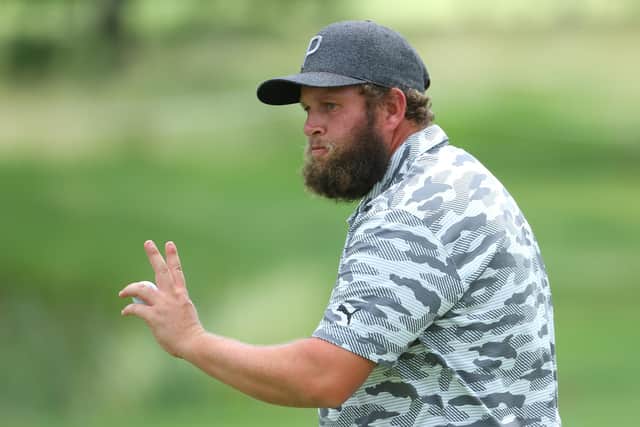 Andrew Johnston acknowledges the crowd on the ninth green during the first round of The BMW International Open at Golfclub Munchen Eichenried.