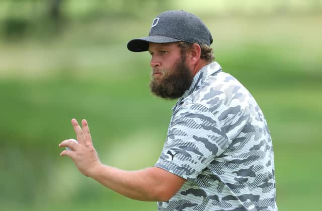 Andrew Johnston acknowledges the crowd on the ninth green during the first round of The BMW International Open at Golfclub Munchen Eichenried.