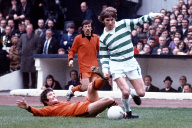 Kenny Dalglish is tackled by Dundee United's Archie Knox during the Scottish Cup final of 1974, which Celtic won 3-0.