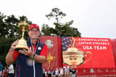 Captain Steve Stricker celebrates with the Ryder Cup after leading the US to a record 19-9 win over Europe at Whistling Straits last September. Picture: Warren Little/Getty Images.
