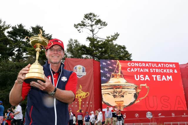 Captain Steve Stricker celebrates with the Ryder Cup after leading the US to a record 19-9 win over Europe at Whistling Straits last September. Picture: Warren Little/Getty Images.