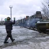 A Russian armoured vehicle drives off a railway platform after arrival in Belarus. Picture: Russian Defense Ministry Press Service via AP