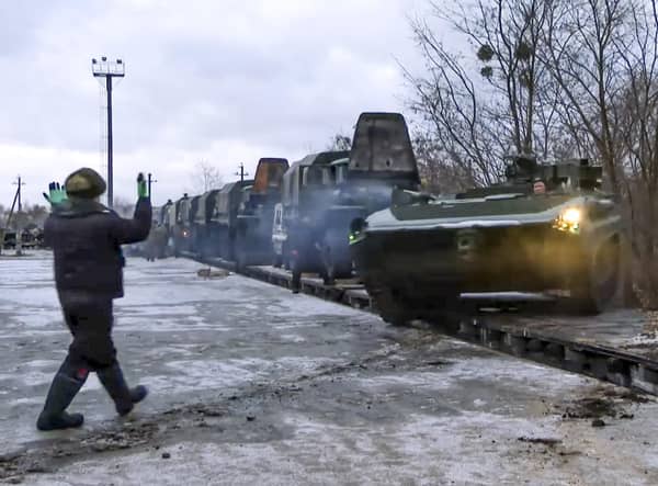 A Russian armoured vehicle drives off a railway platform after arrival in Belarus. Picture: Russian Defense Ministry Press Service via AP