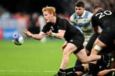 Finlay Christie of New Zealand passes the ball during the Rugby World Cup semi-final win over Argentina at the Stade de France. (Photo by Mike Hewitt/Getty Images)