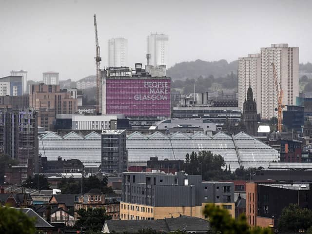 The bank, which now has a base in Glasgow, has lent to Bruntwood SciTech to acquire and redevelop the city's Met Tower, famous for its People Make Glasgow signage. Picture: Andy Buchanan/AFP via Getty Images.