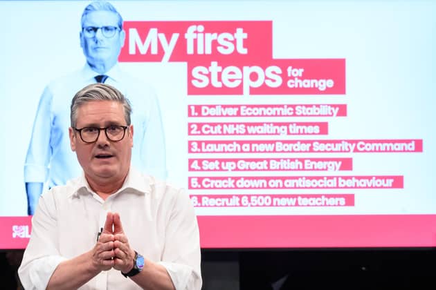 With rolled-up sleeves, Keir Starmer gets down to the job of unveiling his election pledges, a look and a move which drew comparisons with Tony Blair (Picture: Leon Neal/Getty Images)