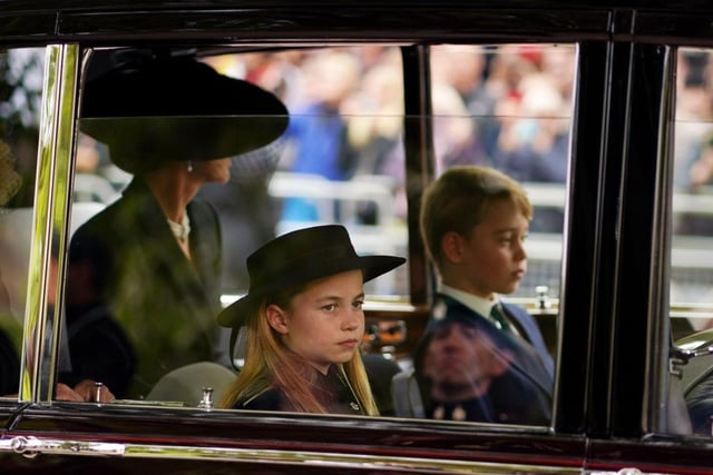 Catherine, Princess of Wales, Princess Charlotte of Wales and Prince George of Wales leaving Westminster Abbey during the State Funeral of Queen Elizabeth II.