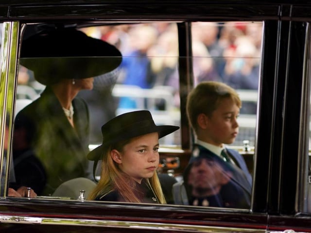 Catherine, Princess of Wales, Princess Charlotte of Wales and Prince George of Wales leaving Westminster Abbey during the State Funeral of Queen Elizabeth II.