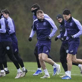 Hibs train in the wind and rain ahead of facing Livingston on Saturday.