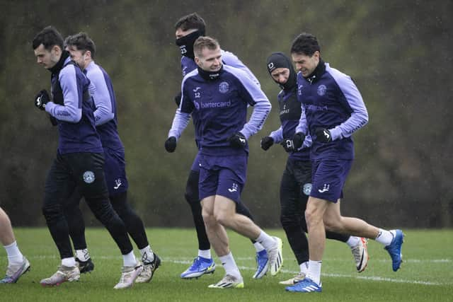 Hibs train in the wind and rain ahead of facing Livingston on Saturday.