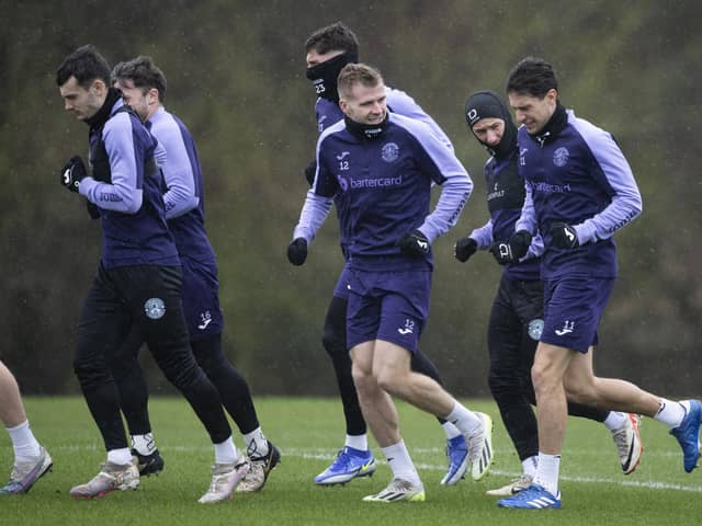 Hibs train in the wind and rain ahead of facing Livingston on Saturday.