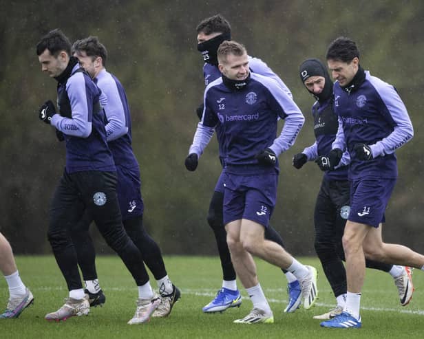Hibs train in the wind and rain ahead of facing Livingston on Saturday.