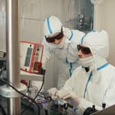 UniKLasers engineers work on the Solo 640 – the only single frequency DPSS red laser with 1000 mW output power on the market.
