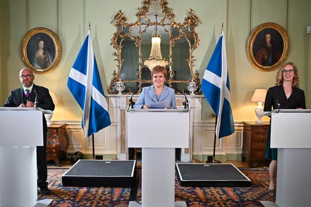 First Minister Nicola Sturgeon with Scottish Greens co-leaders Patrick Harvie and Lorna Slater, brought into the Government to support the SNP. (Picture: Jeff J Mitchell/Pool/Getty