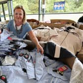 Sheena Hales sorts out clothing donations at the RBS Conference Centre at Gogarburn.