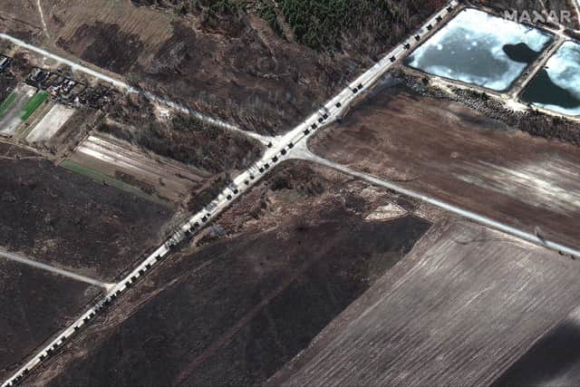 This Maxar satellite image taken and released on February 28, 2022 shows a military convoy along a highway, north of Ivankiv, Ukraine. A Russian military convoy around 40 miles long is north of Kyiv and there are fears that the city will face a barrage of rockets and shells which could inflict devastating civilian casualties.