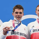Tom Dean, right, with Duncan Scott on the podium after the the final of the men's 200m freestyle swimming event