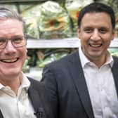 Labour Party leader Sir Keir Starmer (left) and Anas Sarwar, leader of the Scottish Labour Party, during a visit to the Stalks & Stem store, a small business in Shawlands, Glasgow. Picture date: Friday December 2, 2022.