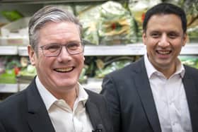 Labour Party leader Sir Keir Starmer (left) and Anas Sarwar, leader of the Scottish Labour Party, during a visit to the Stalks & Stem store, a small business in Shawlands, Glasgow. Picture date: Friday December 2, 2022.