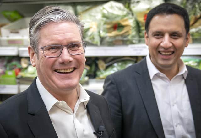 Labour Party leader Sir Keir Starmer (left) and Anas Sarwar, leader of the Scottish Labour Party, during a visit to the Stalks & Stem store, a small business in Shawlands, Glasgow. Picture date: Friday December 2, 2022.