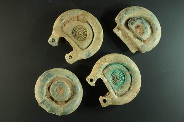 Decorative pieces from the Bronze Age horse harness that was found near Peebles with the animal believed to have been highly adorned as an expression of power. PIC PA/Crown Office.