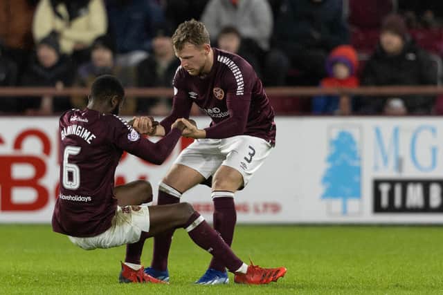 Hearts hope to have midfielder Beni Baningime fit for the visit of Aberdeen.