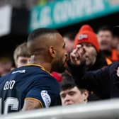 Aberdeen's Funso Ojo confronts a Dundee United fan leading to him being sent off (Photo by Mark Scates / SNS Group)