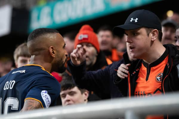 Aberdeen's Funso Ojo confronts a Dundee United fan leading to him being sent off (Photo by Mark Scates / SNS Group)