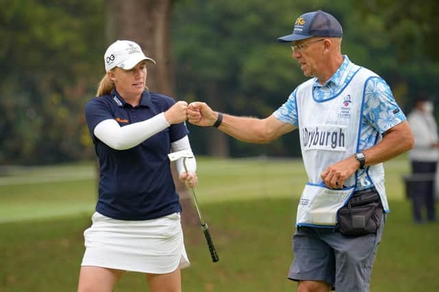 Gemma Dryburgh, pictured fist bumping her caddie last year, will be looking for another strong season on the LPGA Tour in 2024. Picture: Yoshimasa Nakano/Getty Images.
