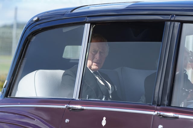 King Charles III and the Queen Consort leave Edinburgh Airport by car after travelling from London, ahead of joining the procession of Queen Elizabeth's coffin from the Palace of Holyroodhouse to St Giles' Cathedral, Edinburgh. Picture date: Monday September 12, 2022.