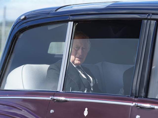 King Charles III and the Queen Consort leave Edinburgh Airport by car after travelling from London, ahead of joining the procession of Queen Elizabeth's coffin from the Palace of Holyroodhouse to St Giles' Cathedral, Edinburgh. Picture date: Monday September 12, 2022.