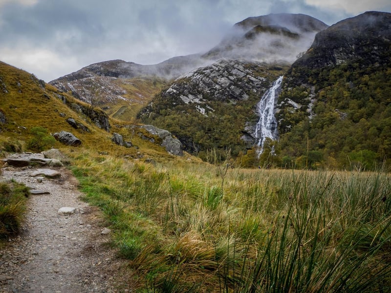 In the middle reaches of Glen Nevis are the Polldubh Falls but even more impressive are the mighty Steall Falls which cascade down 393 feet from the mountains of the Mamores. To get there you have to brave it across a three-wire bridge over the river.